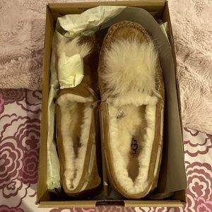 Ugg W Dakota Pom Pom slippers. New in original box. Size 7